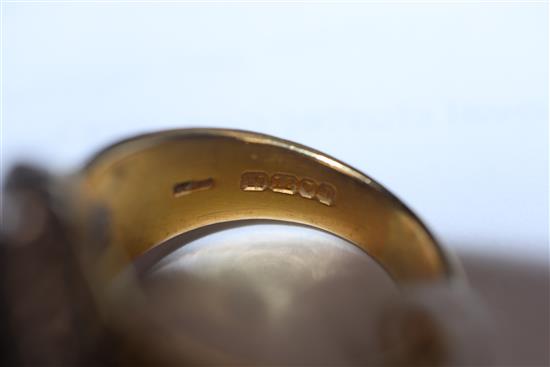A 1960s textured 18ct gold, sapphire and diamond oval cluster ring, size L.
